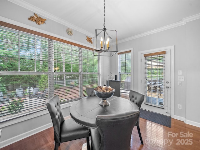 1808 Mill Chase Ln, Waxhaw, NC 28173 - dining space with a chandelier, crown molding, and wood finished floors