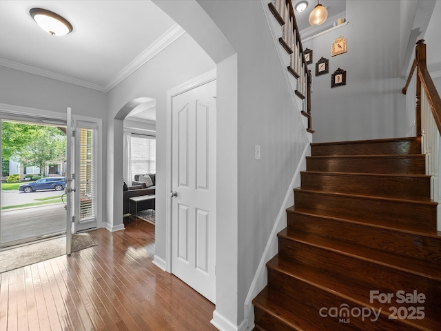 1808 Mill Chase Ln, Waxhaw, NC 28173 - stairway featuring arched walkways, hardwood / wood-style flooring, and ornamental molding