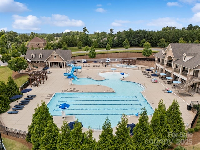 17733 Burnt Hickory Dr, Charlotte, NC 28278 - community pool with a patio, a water slide, and view of wooded area