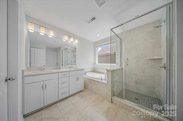 235 Boxelder Rd, Clover, SC 29710 - bathroom with a garden tub, a stall shower, double vanity, and tile patterned flooring