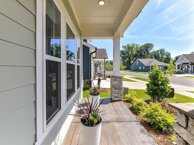 1120 Idyllic Ln, Waxhaw, NC 28173 - covered porch featuring a residential view