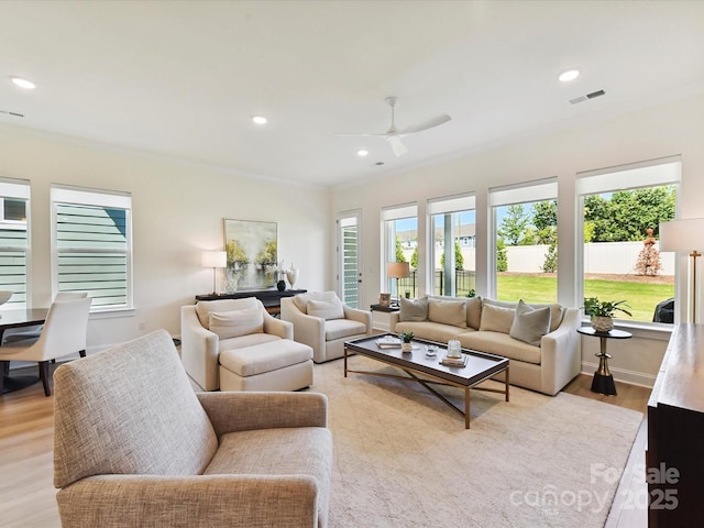 1120 Idyllic Ln, Waxhaw, NC 28173 - living room with light wood-style flooring, ornamental molding, a ceiling fan, and recessed lighting