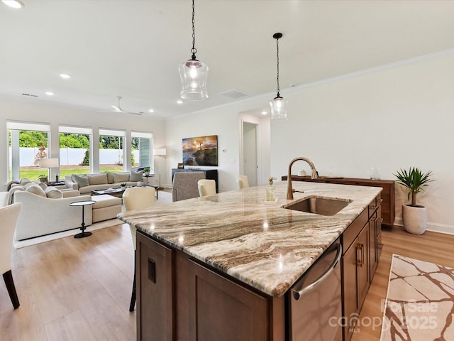 1120 Idyllic Ln, Waxhaw, NC 28173 - kitchen with hanging light fixtures, stainless steel dishwasher, a center island with sink, ornamental molding, and recessed lighting
