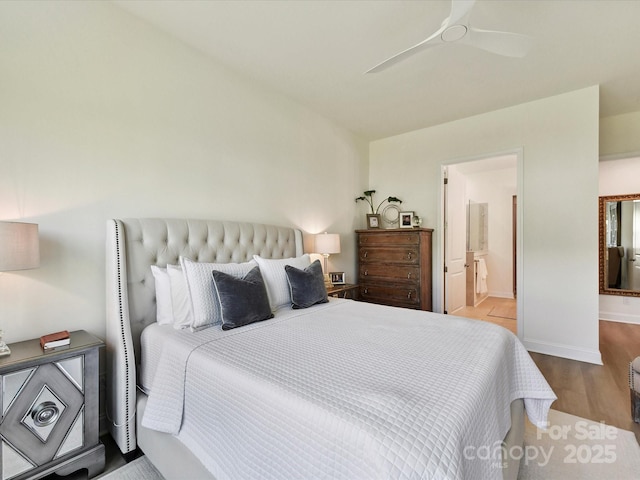 1120 Idyllic Ln, Waxhaw, NC 28173 - bedroom featuring wood finished floors, connected bathroom, and a ceiling fan