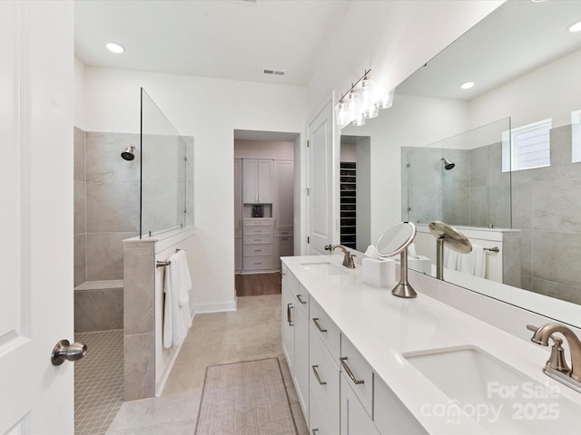 1120 Idyllic Ln, Waxhaw, NC 28173 - full bath with a walk in shower, double vanity, a spacious closet, and recessed lighting