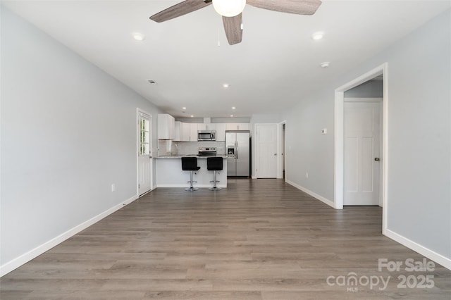 213 Pinewood Dr, Grover, NC 28073 - unfurnished living room with ceiling fan, light wood-style floors, and recessed lighting