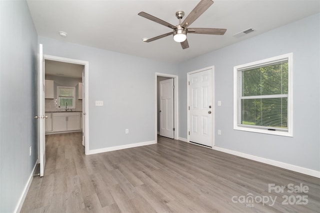 213 Pinewood Dr, Grover, NC 28073 - unfurnished room with ceiling fan, light wood finished floors, and a smoke detector