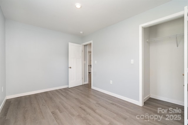 213 Pinewood Dr, Grover, NC 28073 - unfurnished bedroom featuring wood finished floors and a closet