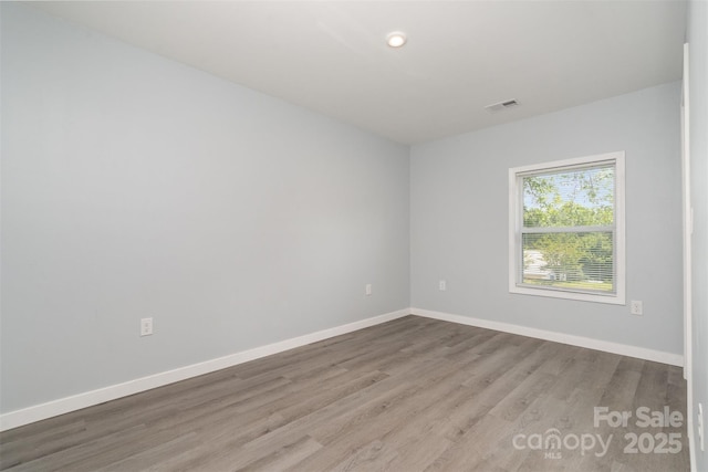 213 Pinewood Dr, Grover, NC 28073 - empty room featuring wood finished floors and recessed lighting