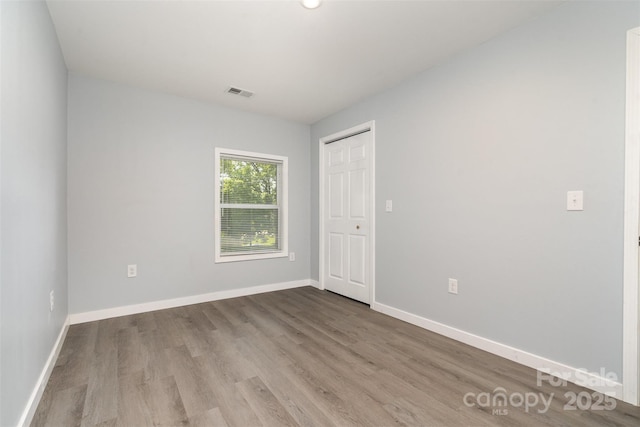 213 Pinewood Dr, Grover, NC 28073 - empty room featuring wood finished floors and baseboards