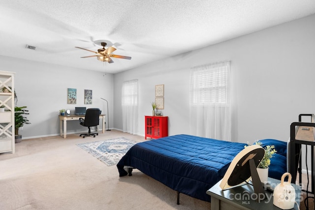 50 Isenhour Park Rd, Taylorsville, NC 28681 - bedroom with an office area, carpet floors, a ceiling fan, and a textured ceiling