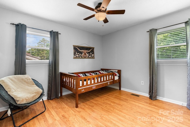 50 Isenhour Park Rd, Taylorsville, NC 28681 - bedroom with light wood-style flooring and a ceiling fan