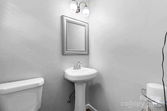 50 Isenhour Park Rd, Taylorsville, NC 28681 - bathroom with toilet and a sink