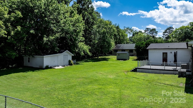 50 Isenhour Park Rd, Taylorsville, NC 28681 - view of yard featuring a shed, a deck, and view of scattered trees
