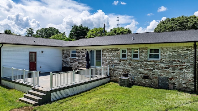 50 Isenhour Park Rd, Taylorsville, NC 28681 - back of property featuring a yard, a deck, brick siding, and roof with shingles