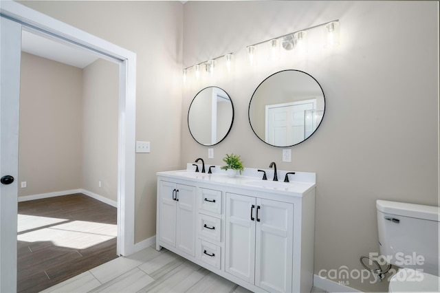 2158 Watson Rd, Lenoir, NC 28645 - bathroom featuring double vanity and wood finished floors
