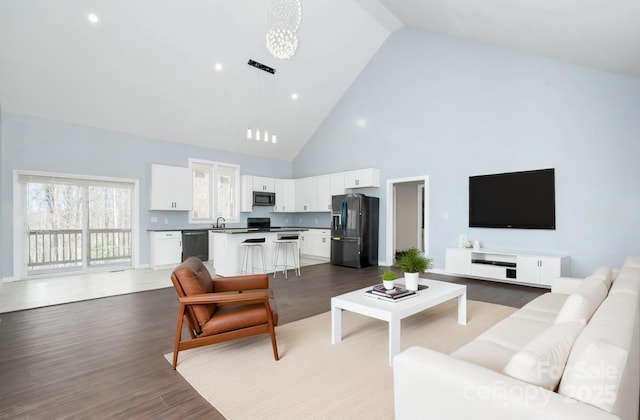 2158 Watson Rd, Lenoir, NC 28645 - living room with high vaulted ceiling and wood finished floors