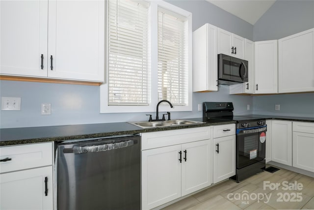 2158 Watson Rd, Lenoir, NC 28645 - kitchen with black appliances, dark countertops, white cabinets, healthy amount of natural light, and lofted ceiling