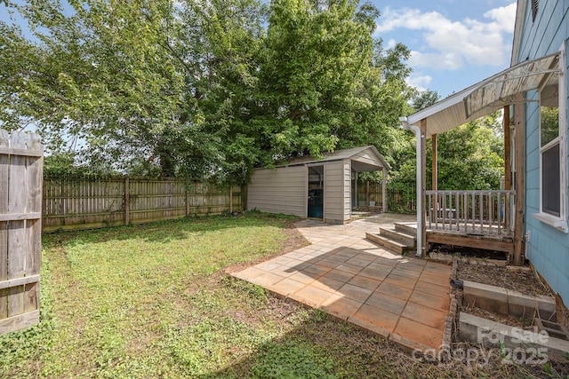 1019 Richard St, Salisbury, NC 28144 - fenced backyard featuring an outdoor structure and a patio area