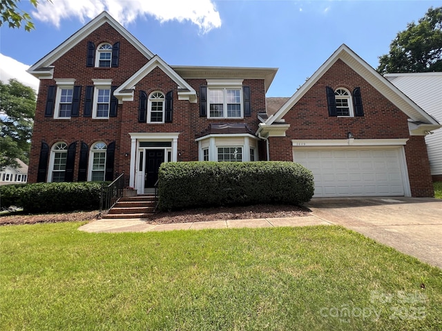 2609 Lamp Post Ln, Kannapolis, NC 28081 - colonial house with concrete driveway, a front lawn, brick siding, and a garage