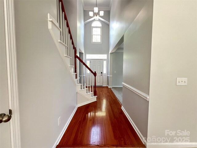 2609 Lamp Post Ln, Kannapolis, NC 28081 - entryway with wood finished floors, stairway, a towering ceiling, and ornamental molding