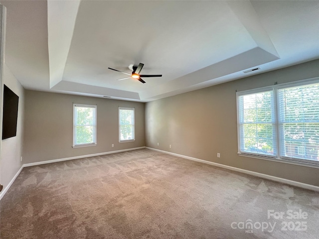 2609 Lamp Post Ln, Kannapolis, NC 28081 - empty room with a tray ceiling, a ceiling fan, and carpet floors
