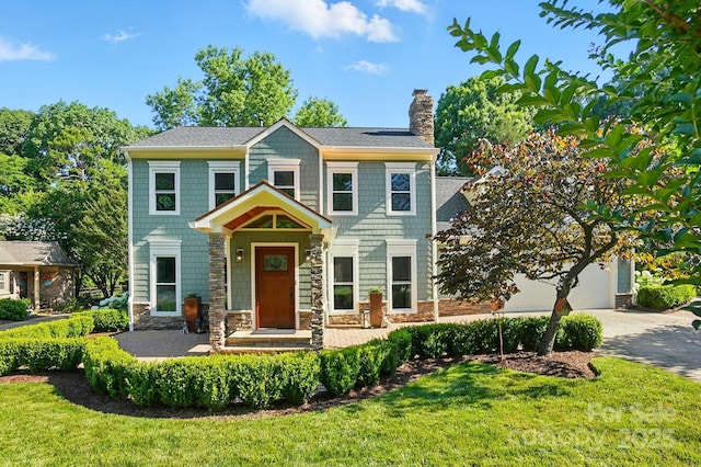 4825 Deanscroft Dr, Charlotte, NC 28226 - view of front of house with a chimney, stone siding, a front yard, and driveway