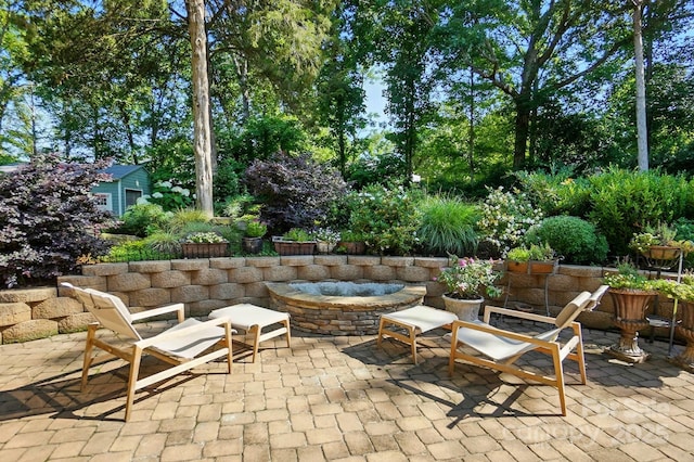 4825 Deanscroft Dr, Charlotte, NC 28226 - view of patio / terrace featuring a fire pit