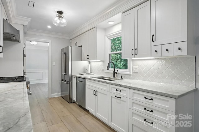 4825 Deanscroft Dr, Charlotte, NC 28226 - kitchen with appliances with stainless steel finishes, white cabinetry, crown molding, light stone countertops, and backsplash