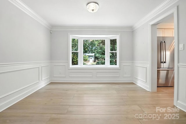 4825 Deanscroft Dr, Charlotte, NC 28226 - empty room with light wood-style flooring, wainscoting, ornamental molding, and a decorative wall
