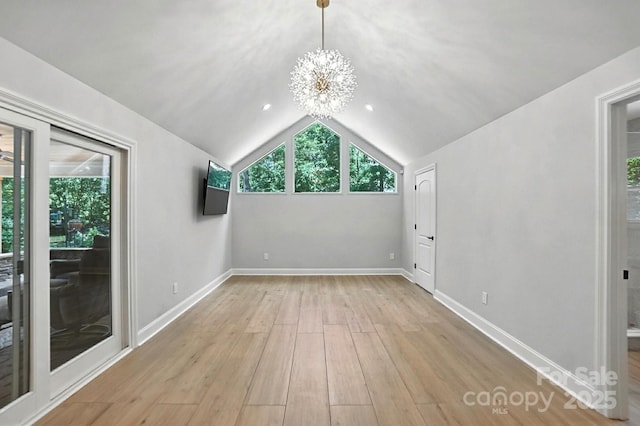 4825 Deanscroft Dr, Charlotte, NC 28226 - bonus room with a chandelier, light wood-style floors, and lofted ceiling