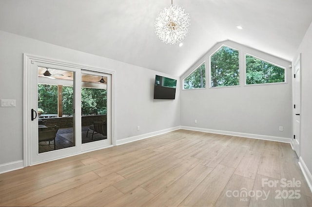 4825 Deanscroft Dr, Charlotte, NC 28226 - spare room with light wood finished floors, lofted ceiling, and a chandelier