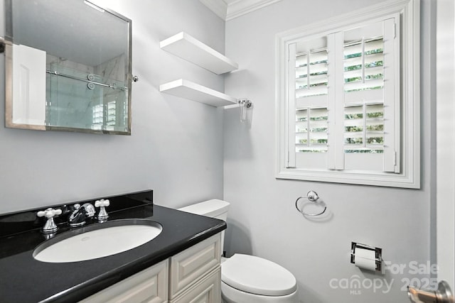 4825 Deanscroft Dr, Charlotte, NC 28226 - bathroom featuring a shower with door, vanity, and ornamental molding