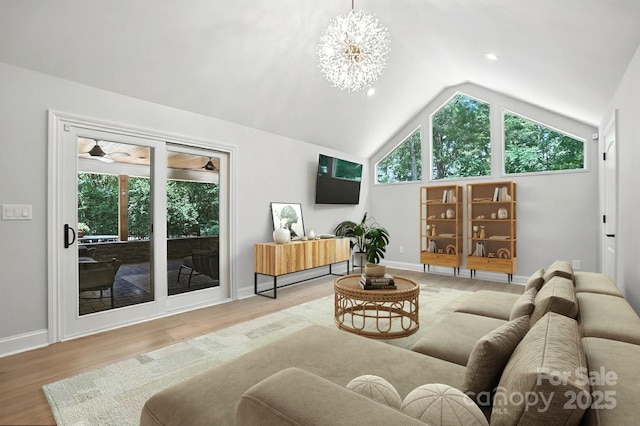 4825 Deanscroft Dr, Charlotte, NC 28226 - living area with wood finished floors, lofted ceiling, a chandelier, and recessed lighting