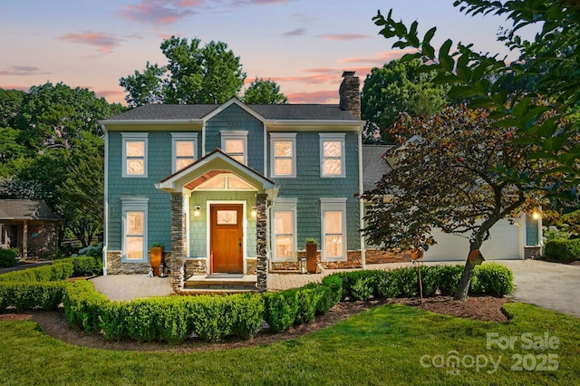 4825 Deanscroft Dr, Charlotte, NC 28226 - colonial inspired home with a chimney, stone siding, concrete driveway, an attached garage, and a front lawn