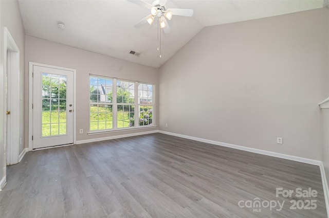 168 Devon Forest Dr, Mooresville, NC 28115 - empty room featuring a ceiling fan, vaulted ceiling, wood finished floors, and a smoke detector