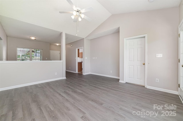 168 Devon Forest Dr, Mooresville, NC 28115 - unfurnished living room with a ceiling fan, wood finished floors, and high vaulted ceiling