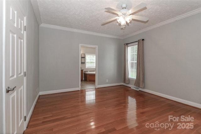 5890 Alley Rd, Catawba, NC 28609 - spare room with wood finished floors, ceiling fan, a textured ceiling, and ornamental molding