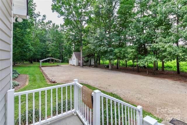 5890 Alley Rd, Catawba, NC 28609 - view of patio featuring driveway, a detached carport, and a storage shed