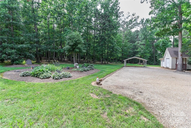 5890 Alley Rd, Catawba, NC 28609 - view of green lawn with a detached carport, driveway, and a shed