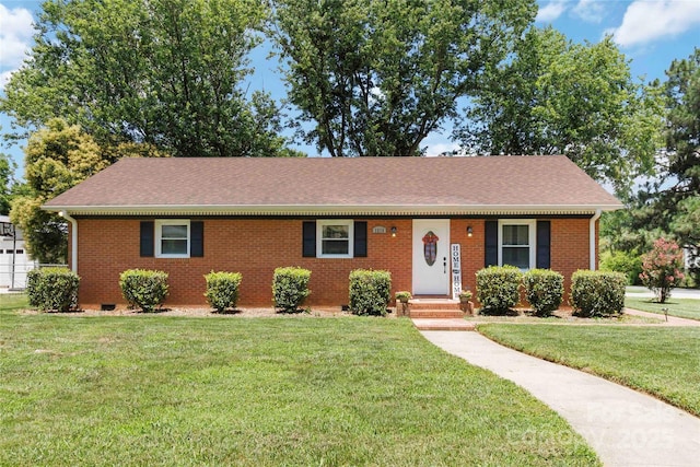 1219 Flowe Dr, Matthews, NC 28104 - view of front of home featuring brick siding, a front yard, and roof with shingles