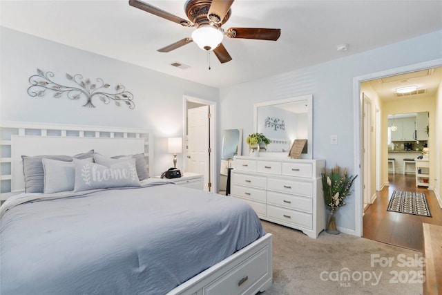 1219 Flowe Dr, Matthews, NC 28104 - bedroom featuring attic access, light colored carpet, and a ceiling fan