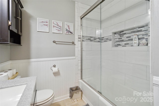 1219 Flowe Dr, Matthews, NC 28104 - full bath with combined bath / shower with glass door, wainscoting, and vanity
