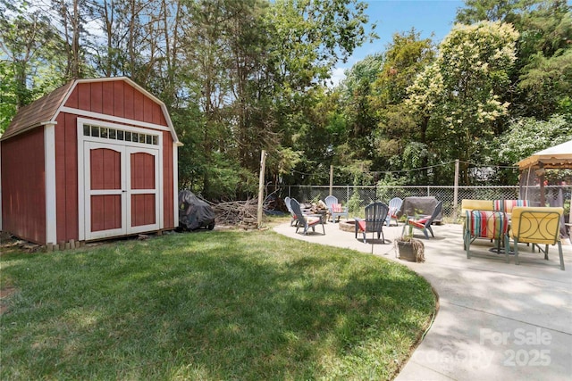 1219 Flowe Dr, Matthews, NC 28104 - view of yard featuring a shed, a patio, and a fire pit