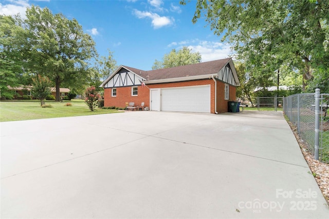 1219 Flowe Dr, Matthews, NC 28104 - view of property exterior featuring concrete driveway, brick siding, and an attached garage