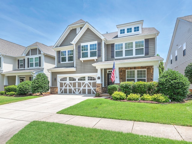 1109 Saratoga Blvd, Indian Trail, NC 28079 - craftsman inspired home with concrete driveway, a garage, a front lawn, and stone siding
