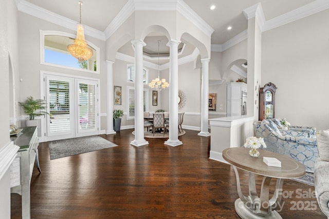 3394 Governors Island Dr, Denver, NC 28037 - foyer entrance with decorative columns, a high ceiling, dark wood-type flooring, a chandelier, and ornamental molding