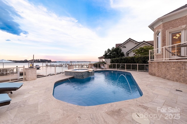 3394 Governors Island Dr, Denver, NC 28037 - pool at dusk with a pool with connected hot tub, a water view, and a patio area