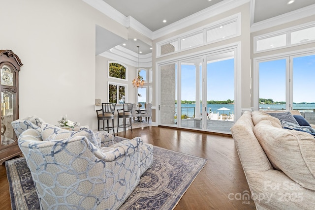 3394 Governors Island Dr, Denver, NC 28037 - living room featuring a high ceiling, crown molding, a water view, wood finished floors, and recessed lighting