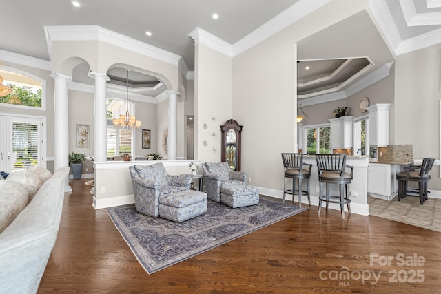 3394 Governors Island Dr, Denver, NC 28037 - living room with decorative columns, a towering ceiling, a chandelier, crown molding, and recessed lighting